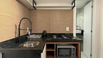 Fridge, microwave, stovetop, cookware/dishes/utensils