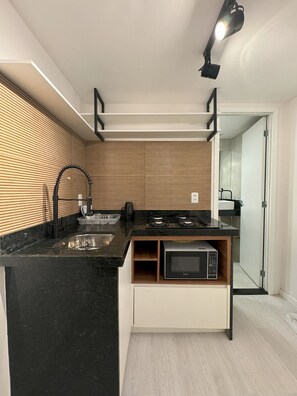 Fridge, microwave, stovetop, cookware/dishes/utensils