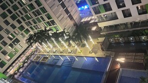 A high-rise hotel with a swimming pool, multiple floors, and balconies. - The Wellington-Republic Plaza Airport (Ho Chi Minh City)