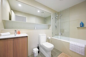 Shower, hair dryer, towels, toilet paper