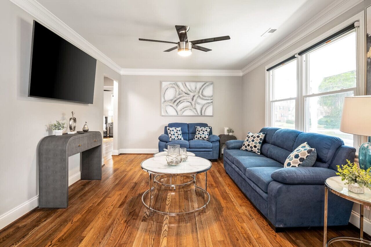 Kick back and relax in style! The open, modern, living room features a plush couch and large Roku TV, perfect for movie nights or board games.