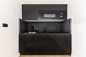 Fridge, microwave, stovetop, coffee/tea maker