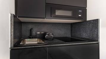 Fridge, microwave, stovetop, coffee/tea maker