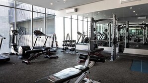 A gym with treadmills, weight machines, and free weights. - Huasteca Mountain Views, Pool, Gym & Balcony (Santa Catarina)