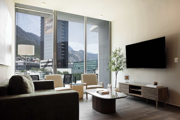 Bright and stylish living room with a Smart TV and incredible mountain views.