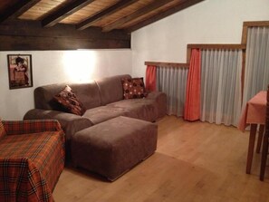 Economy Apartment, Balcony, Mountain View | Living area | Flat-screen TV - Apartments Atlas (Saas Grund)