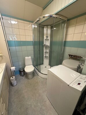 Shower, towels, soap, toilet paper