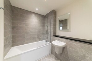 Shower, hair dryer, towels, shampoo