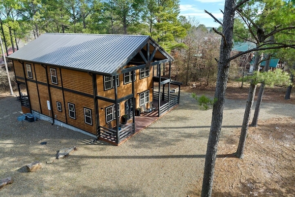Welcome to the charming 2,300-sq-ft cabin, Times Like These, on wooded acreage.
