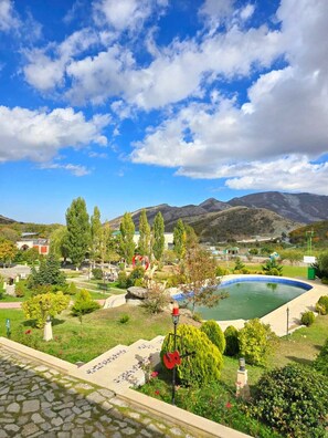 Indoor pool, seasonal outdoor pool, pool umbrellas, lifeguards on site