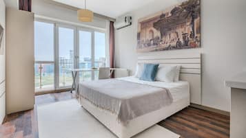 Deluxe Condo, City View | 1 bedroom, desk, laptop workspace, free WiFi