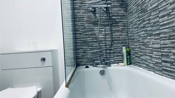 Combined shower/bathtub, hair dryer, towels, soap