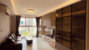 Panoramic Apartment | Living area | 75-cm Smart TV with digital channels, Netflix, streaming services
