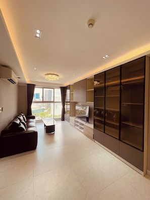Panoramic Apartment | Living area | 75-cm Smart TV with digital channels, Netflix, streaming services