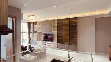 Panoramic Apartment | Living area | 75-cm Smart TV with digital channels, Netflix, streaming services