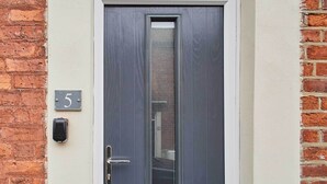 A door with a number plate '5' and a doorbell. - Host & Stay | Number 5 (Whitby)