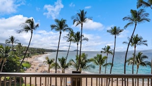 A beach view with palm trees and a clear sky. - Mana Kai Maui Resort, #405a 1 Bedroom Condo (Kihei)