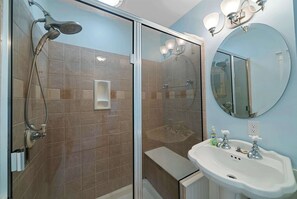 Shower, hair dryer, towels, shampoo