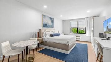 Luxury Studio Suite | In-room safe, desk, laptop workspace, iron/ironing board