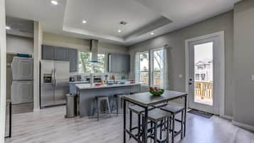 Fridge, stovetop, dishwasher, coffee/tea maker