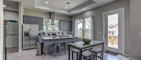 Fridge, stovetop, dishwasher, coffee/tea maker