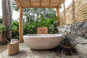 Separate bathtub and shower, free toiletries, hair dryer, slippers