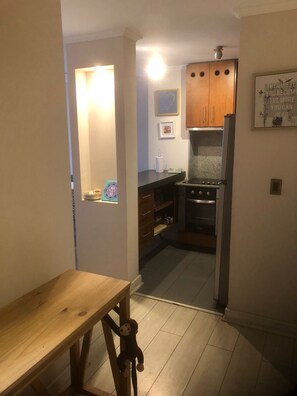 Enjoy cooking in this well-equipped kitchen with an oven, microwave, and refrigerator.