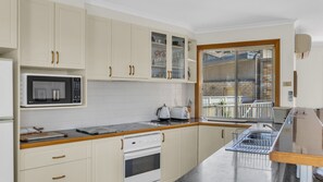 Microwave, dishwasher, dining tables
