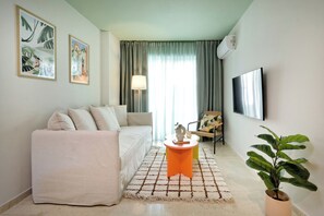 Appartement Deluxe, vue ville | Coin séjour