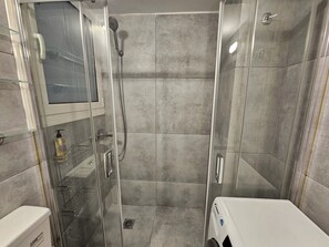 Shower, hair dryer, towels, soap