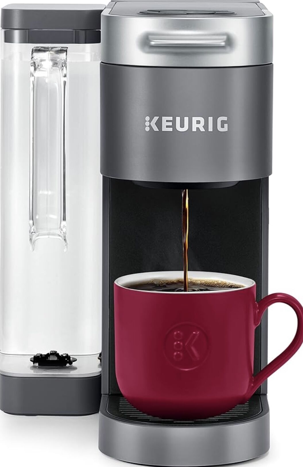 A Keurig coffee maker with a red mug.