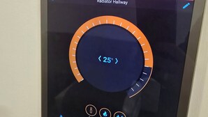 A digital thermostat displaying a temperature of 25°C, with a man on the screen, indicating the room is occupied. - Free Private Transport From Any Dublin Port (Dublin)
