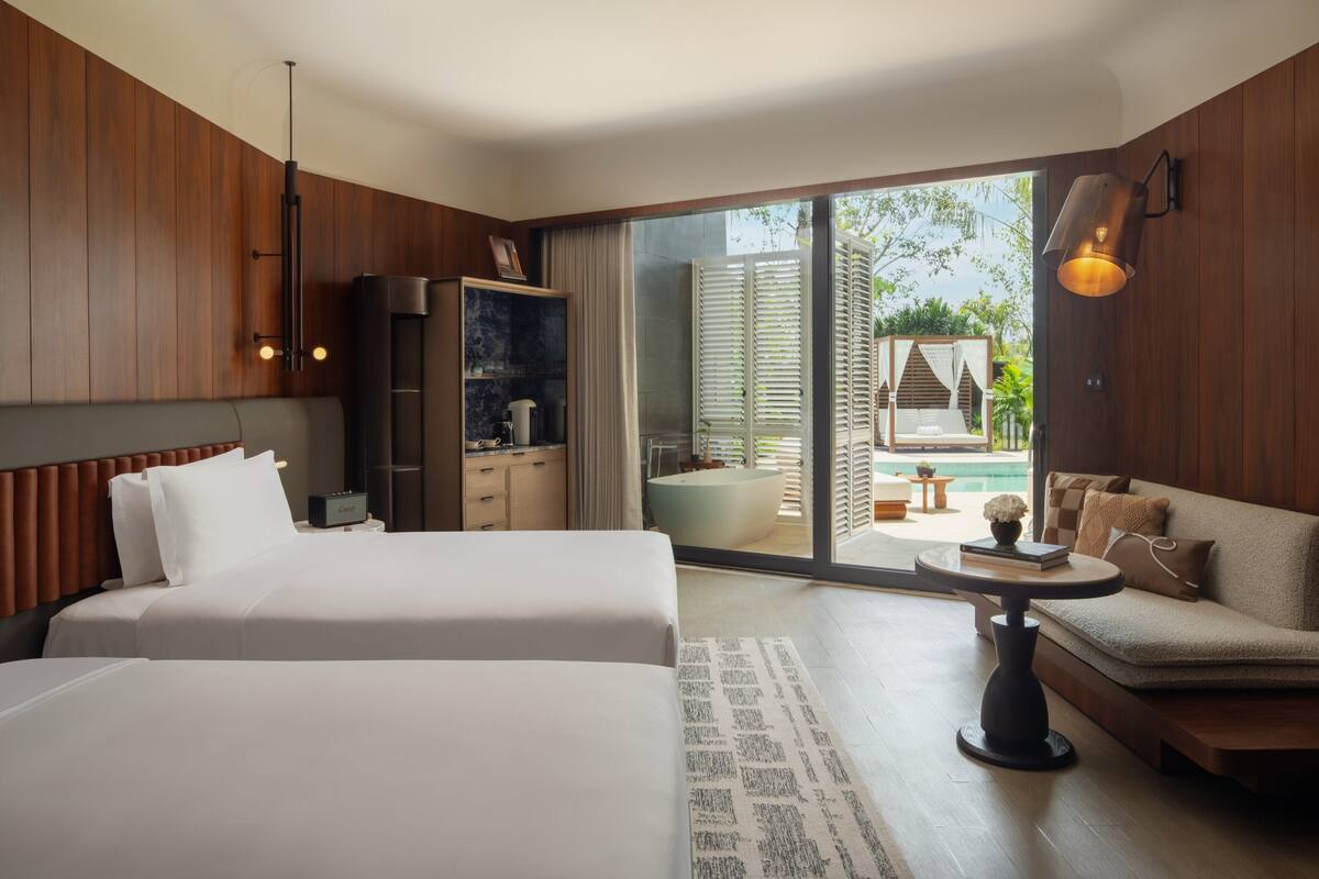 Room, 2 Queen Beds (Essential) | Minibar (free items), in-room safe, desk, blackout drapes