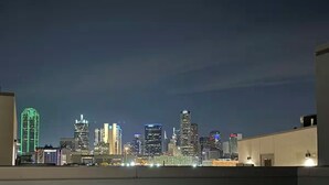 A city skyline at night with illuminated buildings. - The Terrace In Dallas I Downtown Dallas I House (Dallas)