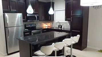 Coffee/tea maker, fridge, microwave, oven