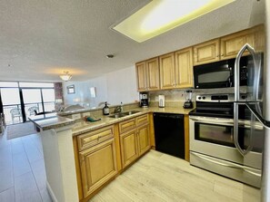 Fridge, microwave, oven, stovetop - Spacious oceanfront 2 bedroom condo Tropical resort near Barefoot Landing 802 (North Myrtle Beach)