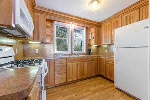 Fridge, coffee/tea maker, cookware/dishes/utensils