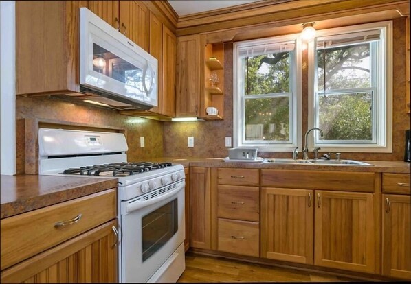 Fridge, coffee/tea maker, cookware/dishes/utensils