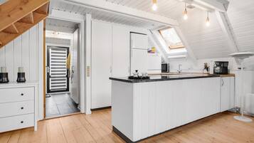 Fridge, stovetop, dishwasher, coffee/tea maker