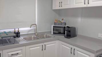 Fridge, microwave, stovetop, coffee/tea maker