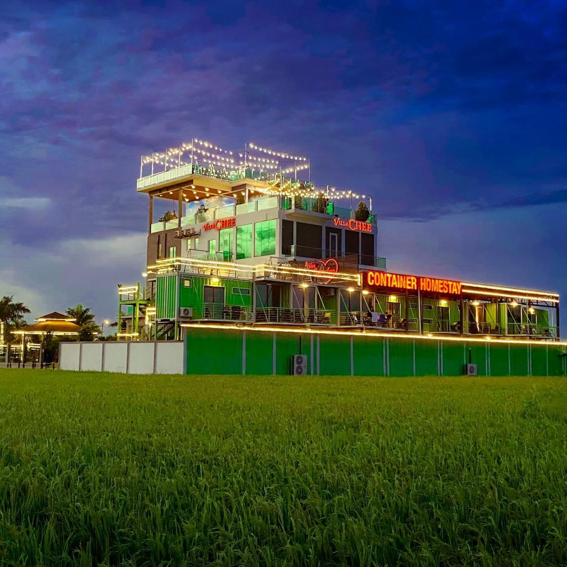 A multi-level building with a restaurant named 'Villa Chiff' and a 'Container Homestay' section.