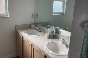 Separate bathtub and shower, deep-soaking bathtub, hair dryer, towels