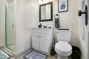 Shower, hair dryer, towels, shampoo