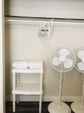 Comfortable accommodations feature a shelf for personal items and two fans for a refreshing breeze.
