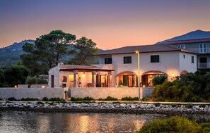 Enjoy a patio area and covered outdoor seating space with a mountain view.