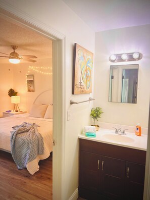 Shower, hair dryer, towels, toilet paper