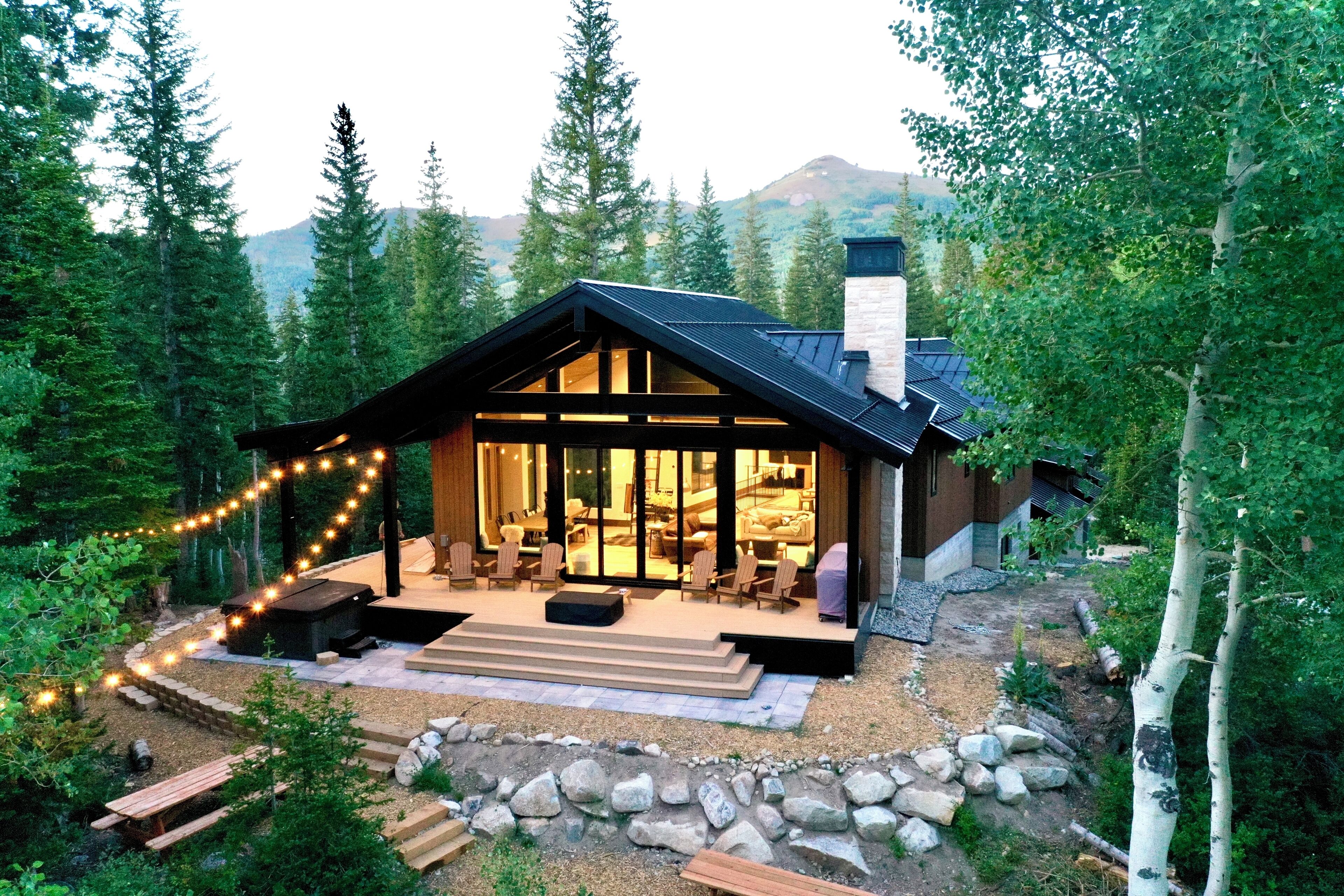 Back of home with Mountain View and two picnic tables.