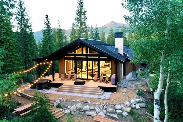 Back of home with Mountain View and two picnic tables.