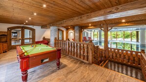 A wooden ceiling, a pool table, and a view of greenery. - Le Cristal GM9 Mountain View, Pool, Parking & Free WiFi, Argentière (Chamonix), France (Argentière (Chamonix))