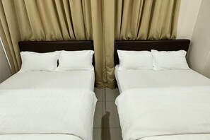 A double bed with white bedding and a dark headboard, curtains, and a tiled floor. - Hotel Lean Fatt (Ipoh)